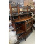 An Aesthetic Movement walnut, ebonised and painted side cabinet, the raised back fitted with three