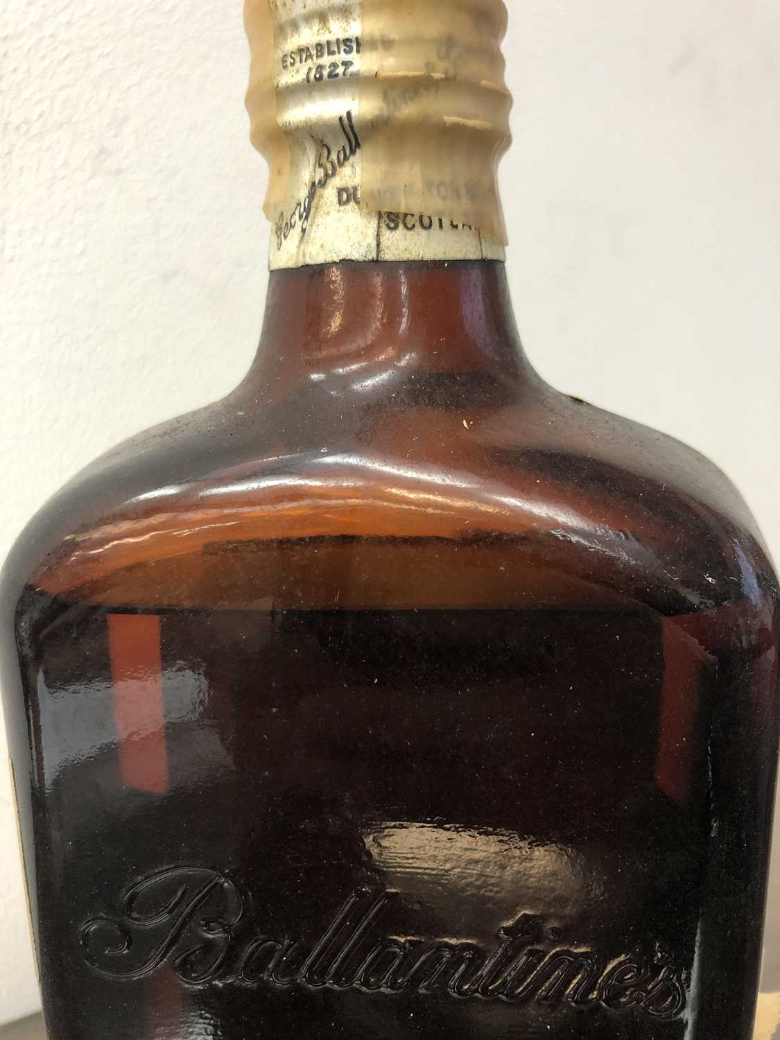 A vintage bottle of Ballantine's finest Scotch Whisky, retaining original tissue wrapper, together - Image 7 of 7