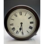 A mahogany circular wall clock, with a single fusee movement stamped Elliott and dated 1941, and
