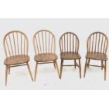 An ercol light elm dining table, a set of four elm and beech dining chairs, stamped 'BS AF 1960,