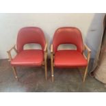 A pair of retro armchairs, height 74cm, width 53.5cm.