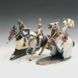 Three models of knights on horseback. Tallest 28cm high.