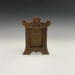 An Edwardian copper finish photograph frame decorated with Regency motifs. Height 22.5cm.