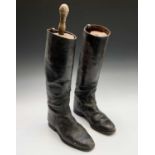 A pair of black leather riding boots, with trees by Bartley & Sons of Oxford Street. (one section