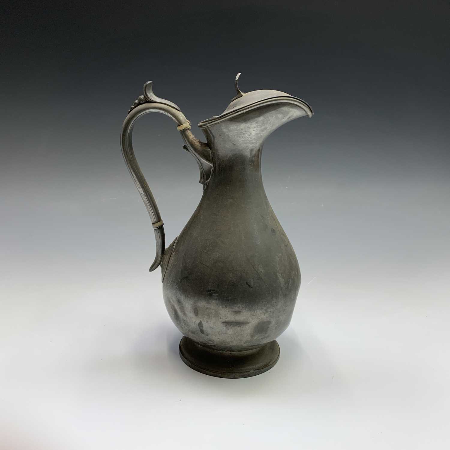 A 19th century pewter flagon with hinged cover, engraved with tulips and initialled G.A.K. and dated - Image 8 of 20