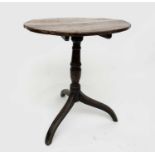 A George III oak tripod table, height 68cm, diameter of top 55.5cm.Condition report: joints are firm
