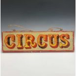 A written wooden sign 'CIRCUS'. 19 x 66cm. Condition report: A reclaimed wooden plank artificially