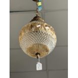A 20th century gilt metal and moulded glass centre light fitting with spherical shade. Approx.