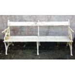 A Victorian garden bench, the cast iron ends and centre decorated with ivy covered branch