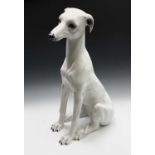 Near life-sized continental pottery model of a greyhound, 20th century, height 78cm.