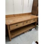 A Victorian pine kitchen dresser, with a solid gallery and rectangular top above three frieze