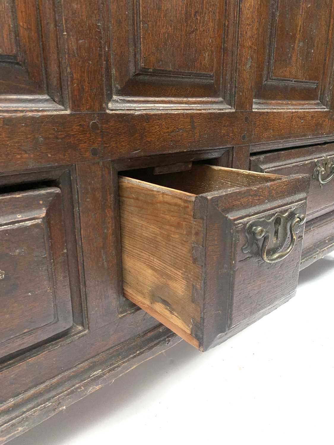 A George III oak mule chest, the front with seven fielded moulded panels above an arrangement of - Image 3 of 5
