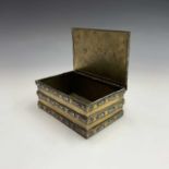 An Oriental brass and enamel rectangular box, decorated with bands of scrolls, fans and similar