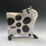 Lanson Rudge, a raku studio pottery figure of a cow, number '55', width 32cm.Condition report: