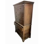 A mahogany chest on chest, the upper part with dentil cornice above two short and three long