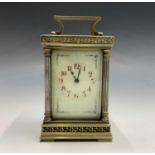 French carriage clock with red enamel Roman numerals and floral spandrels, later escapement