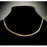 A 10ct gold flat snake link necklace 14.9gm