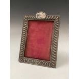 A silver-mounted photograph frame with embossed gadrooning Birmingham 1903 14 x 9.5cm internal