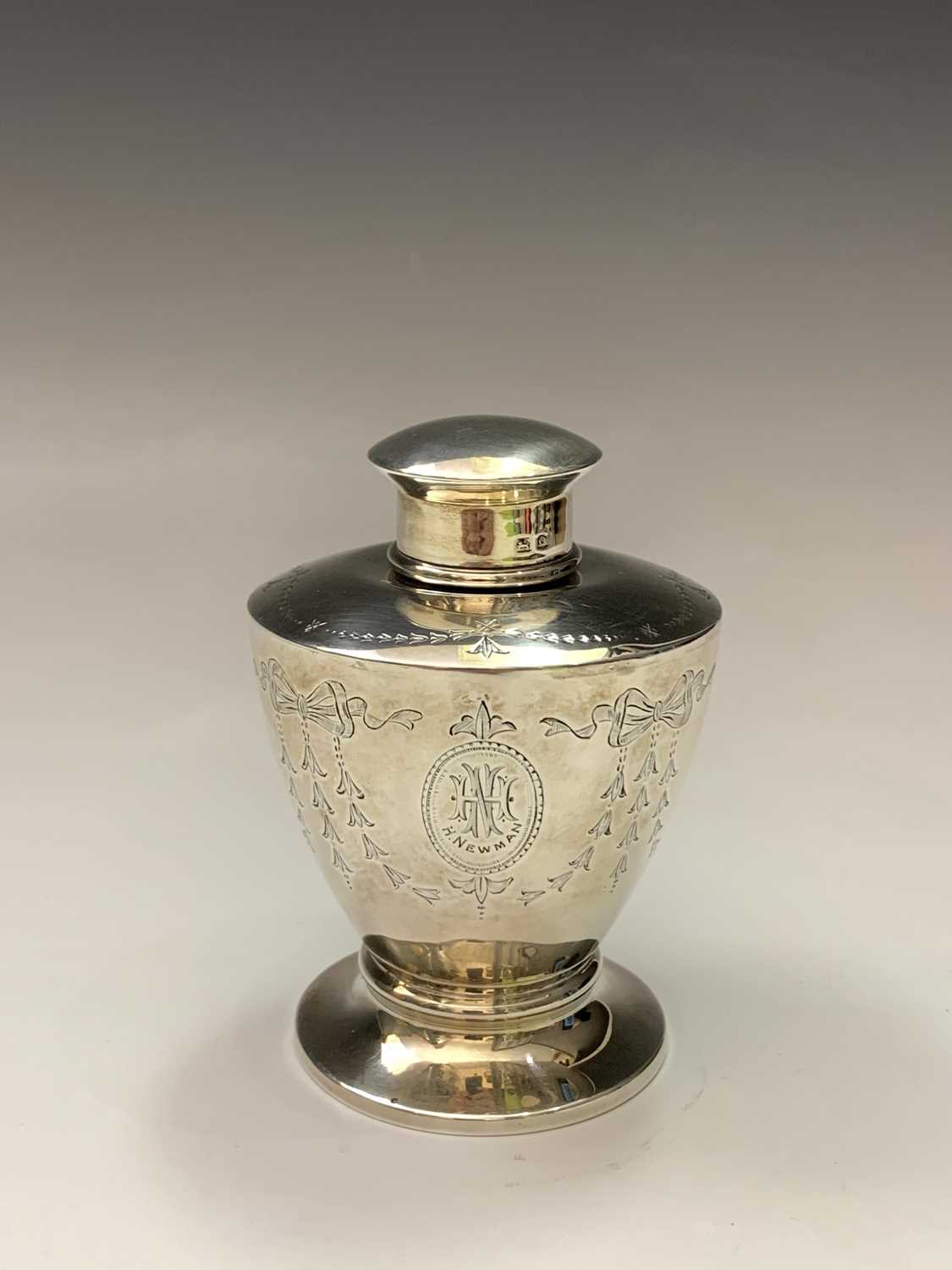 A silver vase shape tea caddy by George Unite with Adam style engraved decoration, London 1913 2.