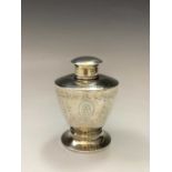 A silver vase shape tea caddy by George Unite with Adam style engraved decoration, London 1913 2.