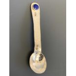 A silver small spoon by Felicity Moore set with a lapis cabochon London 2014