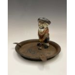 A rare Dunlop golf ball advertising ashtray, in it stands the cast metal cold coloured figure with