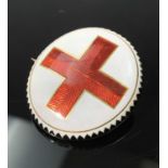 A very finely enamelled gold brooch with a central red cross on a white background and black border,