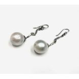 A pair of elegant pearl and diamond drop earrings, 9g.