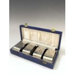 A set of four silver napkin rings with the bold 1977 jubilee hallmarks forming the decoration. 4.4oz