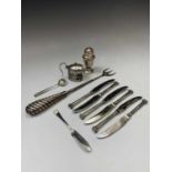A Victorian toasting fork with filled silver spiral handle together with six tea knives with