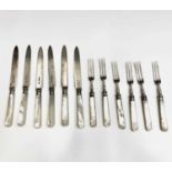 A set of six dessert knives and forks by Goldsmiths & Silversmiths Co Ltd pearl handles