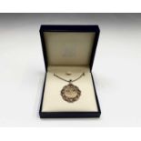 A full Sovereign 2003 in diamond-set gold pendant mount with chain 15.8gm