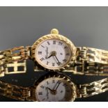 A ladies gold watch with gold bracelet by Sovereign, casedCondition report: The watch weighs 9.4