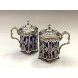 A pair of French silver pierced and embossed mustards with blue glass liners mustard pots 5.8oz