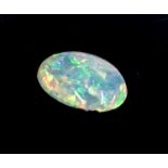 An unmounted oval opal weighing 1.29 cts, 8mm x 10mm.Condition report: This is a solid opal. No sign