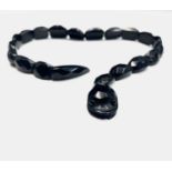 A jet bead snake necklace