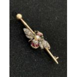 A good Victorian gold bumble bee brooch set with diamonds and rubies, the thorax a pearl, the eyes