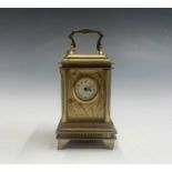 A French Art Nouveau gilt bronze miniature alarm carriage clock.