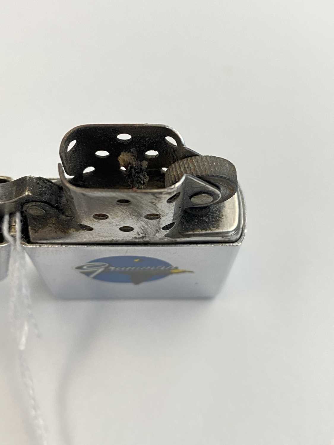 A Zippo Town and Country lighter advertising Grumman AviationCondition report: The wick is used. - Image 4 of 6