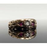 A Victorian style Chester 15ct gold ring set a diamond and two rubiesCondition report: 2.1gm