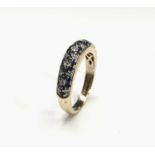 A stylish 18ct gold ring pave half hoop set with diamonds and sapphires in three rows