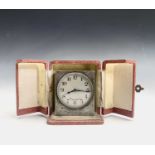 A French square silver carriage clock with engraved decoration to five sides the circular matte
