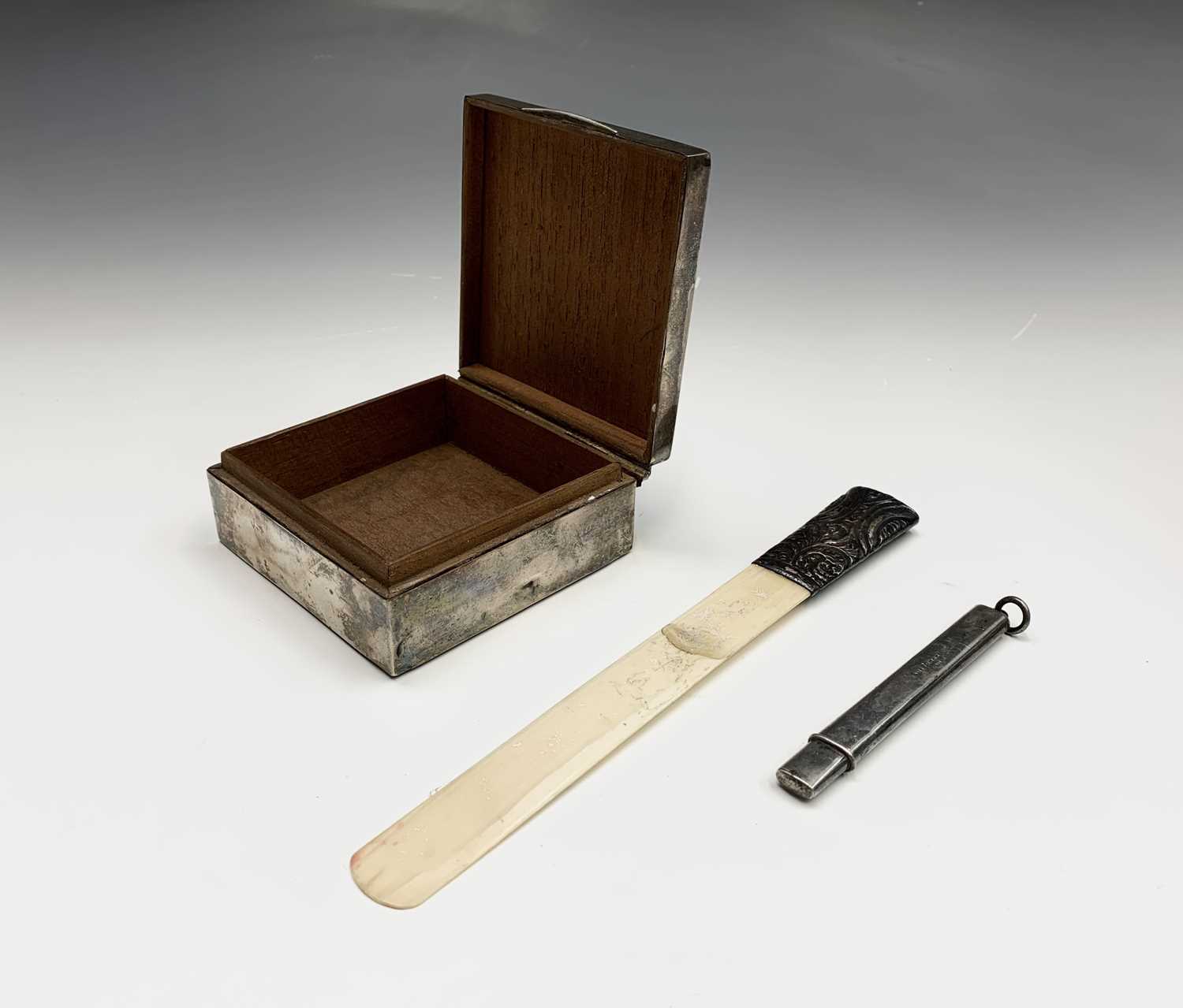 A Mordan silver pencil, a silver cigarette box and a paper-knife