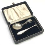 A cased silver spoon and pusher christening set.