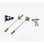 Two gold sailors stick pins, a Royal Cornwall Yacht Club enamelled silver burgee brooch and a pair