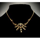 A 9ct gold Edwardian necklace set with pearls and amethystCondition report: The chain is infact