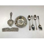 Three pieces of Dutch embossed silver and four Georgian silver teaspoons 4.6oz