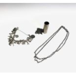 A silver-coloured charm bracelet, silver lighter holder and chain and one other chain 118gm