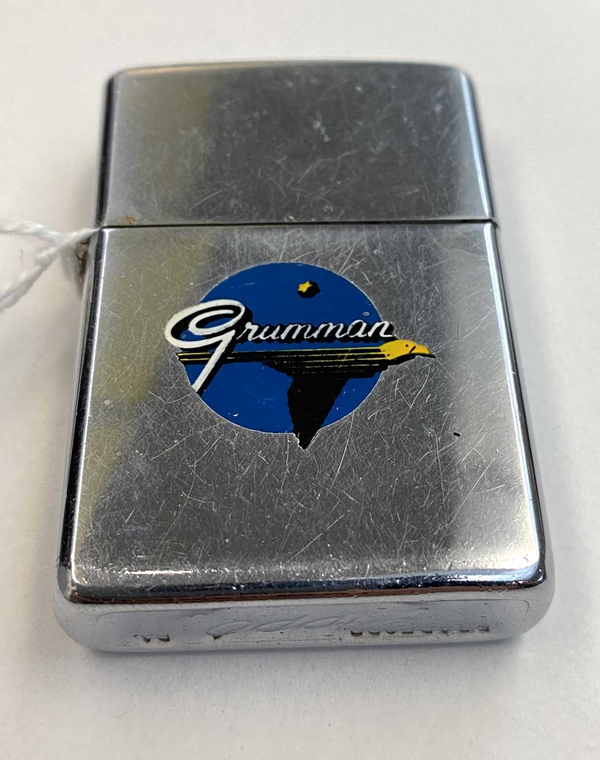 A Zippo Town and Country lighter advertising Grumman AviationCondition report: The wick is used. - Image 6 of 6