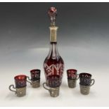 A Bohemian silver mounted cut overlay decanter and five matching tots each with a silver